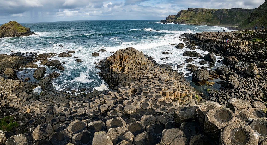 ireland Looking down a perfectly formed basalt column pathway that forms the unique landscape of the Giant's Causeway, leading into the ocean.