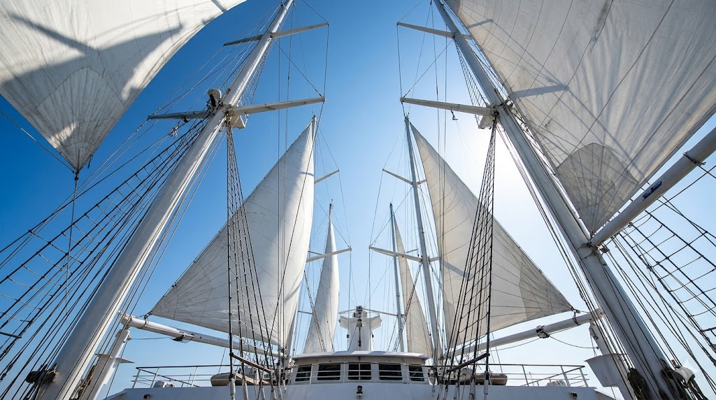 windstar A crisp, clear daytime shot looking straight up at the towering masts and billowing white canvas of the Wind Spirit.